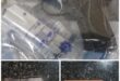 Image of firearms and ammunition in evidence bags.