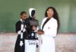 Image of Iris the South African developed 'robot' that assists school chidren in learning and teaching with its developer, Bonisiwe Gumede, and a learner.