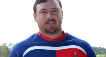 Image of Sentraal rugby captain Xander Kriel in his kit holding a ball.