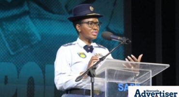 Acting Provincial Commissioner, Major General Phumelele Makoba speaking on a podium.