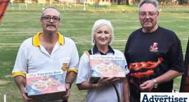 A photo of Wessie van der Westhuizen and Yolanda Boshoff receive their prizes of frozen chicken products from Keith Solomon of Jeremiah Meats.