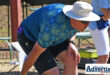 A photo of a bowler on the greens.
