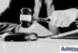 A black and white image of a judge holding a gavel.