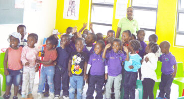 Image of children standing together outside their creche.