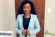 A portrairt photo of a female lawyer dressed in a black shirt and a light blue jacket.