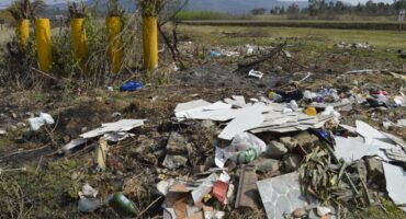 Image of rubble lying in a field.