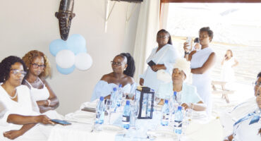 Group of Endumeni ladies sitting and standing to mark the Digit Dundee Women's Day event.