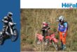 Image of an adult helping a younger motorbike rider.