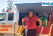Image of a paramedic in front of an emergency vehicle.
