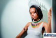 A portrait photo of a young woman posing in traditional attire and a grown.