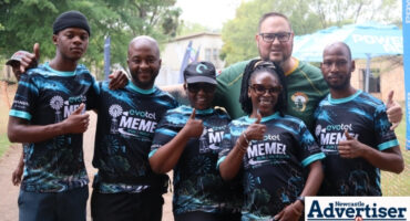 The Evotel Team and Johan Pieters pose for a photo during the 2026 Evotel Memel to Newcastle Run/Walk.