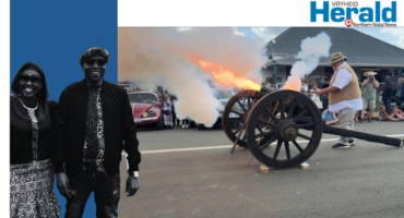 Image of a historic cannon firing.