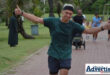 A parkrunner is photographed during a run.