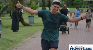 A parkrunner is photographed during a run.