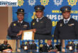 District Commissioner of Amajuba, Major General Fred Alexander, receives a silver award. Below are several other police commisioners receiving awrds and addressing issues.