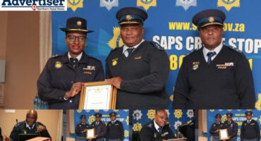 District Commissioner of Amajuba, Major General Fred Alexander, receives a silver award. Below are several other police commisioners receiving awrds and addressing issues.