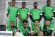 A team photo of a soccer team taken in Newcastle in their green uniform.