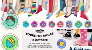 POSTER FULL OF FUNKY SOCKS, BADGES AND THE SOCKS FOR SMILES CAMPAIGN.