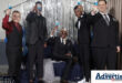 A photograph of a group of young men celebrating their matric farewell in font of a silver backdrop.