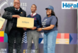 An image of AbaQulusi Mayor, Lindokuhle Ndlozi and Princess Mkabayi Mall representative as Lindokuhle received a brand new laptop for being a top student.