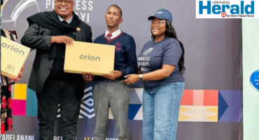 An image of AbaQulusi Mayor, Lindokuhle Ndlozi and Princess Mkabayi Mall representative as Lindokuhle received a brand new laptop for being a top student.