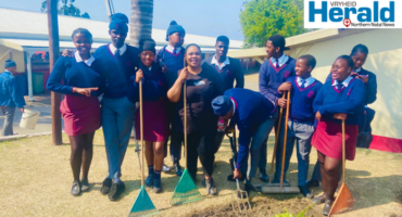A group image of grade 11 learners as they pose with tourism educator Miss Nqobile Makhathini after taking part in the school’s Arbour Day activities.