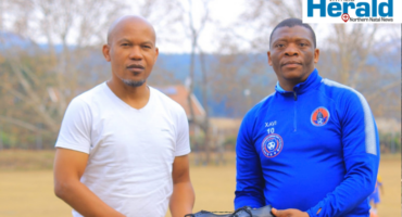 An image of two man, one of them is a soccer legend in Vryheid who lives and breathes football. Through soccer, he opened a foundation that conducts school shoes donation drive to support learners in need.