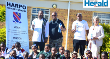 A group image of Harpo Primary School teachers and a representative from Natural Spring Water as the school hosted a 'save water' awareness campaign.