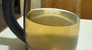 Image of discolured tap water in a kettle.