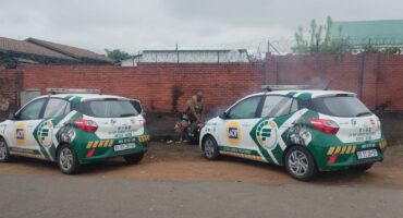 Image of two security vehicles featuring an office with a portable fire extinguisher.