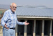 Image of a person with outstretched arms indicating an unfinished toilet block.