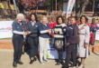 Image of Rotary Club members presenting shoes to a deserving school.