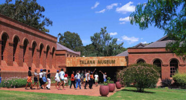 Image of Talana Museum with children in front.