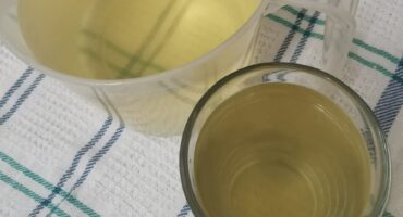 Image of brown coloured water in containers.
