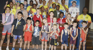 Image of Rhino wrestlers group standing together with their medals.