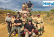 Image of a group of men and women after armed training.