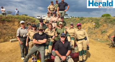 Image of a group of men and women after armed training.