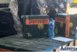 Boxes of alcohol stacked during a police raid.