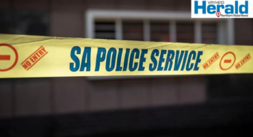 Image of police yellow tape at a crime scene.