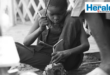 Image of a young African boy building a wire car, Pexels image.