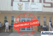A photo of the Newcastle Home Affairs Building, with a big red closed sighn over it.