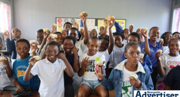 A class full of learners enjoying cupcakes.