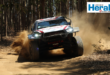 Image of a rally car racing.