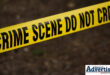 A crime scene tape over a dark background.