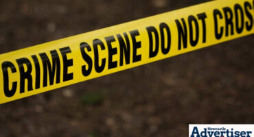 A crime scene tape over a dark background.