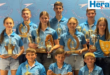 Image of young swimmers holding trophies.