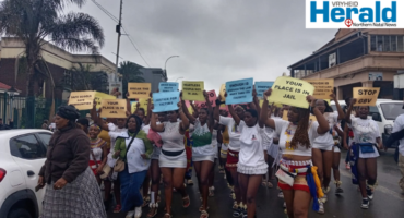 A group image of maidens holding placards of GBV in the streets of Vryheid outside the Vryheid Magistrate’s Court. They were there to show their support for seven other maidens who were allegedly sexually assaulted in Gcluckstadt.