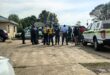 Image of a group of police officers huddled together.