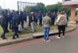 Image security guards and others in plain clothes watching,