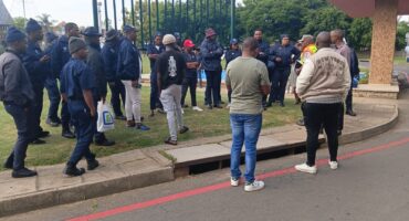 Image security guards and others in plain clothes watching,